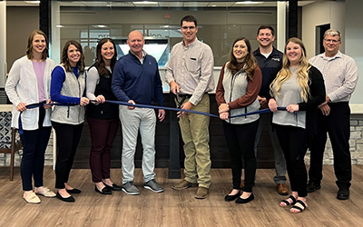 Midwest Bank employees celebrated the opening of a new branch in Wisner with a ribbon-cutting ceremony.
